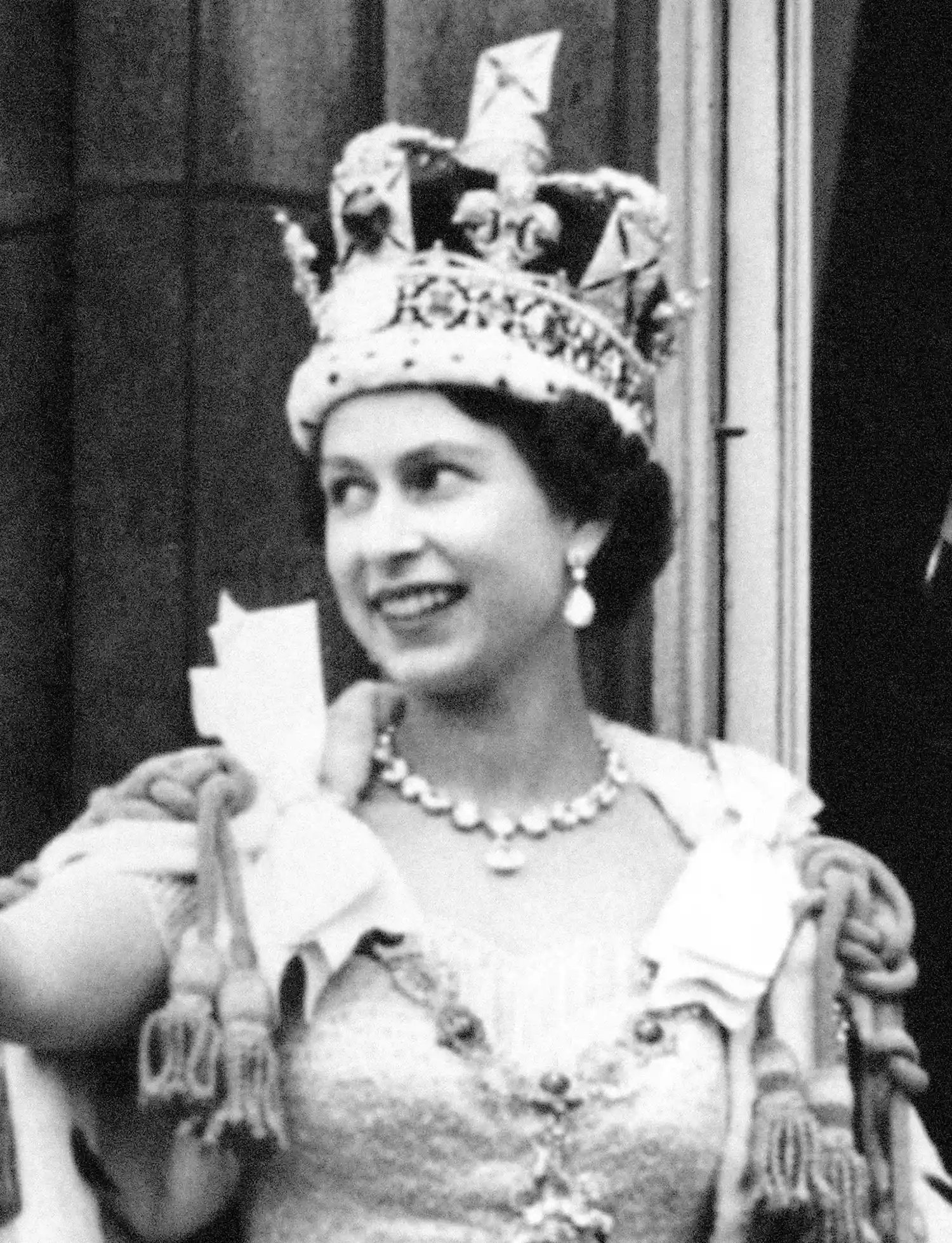 Queen Elizabeth II wearing the Imperial State Crown during her coronation.