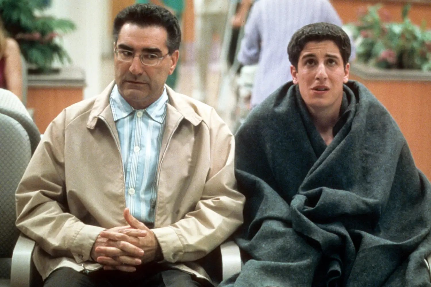 Eugene Levy and Jason Biggs in waiting room in a scene from the film 'American Pie 2', 2001.