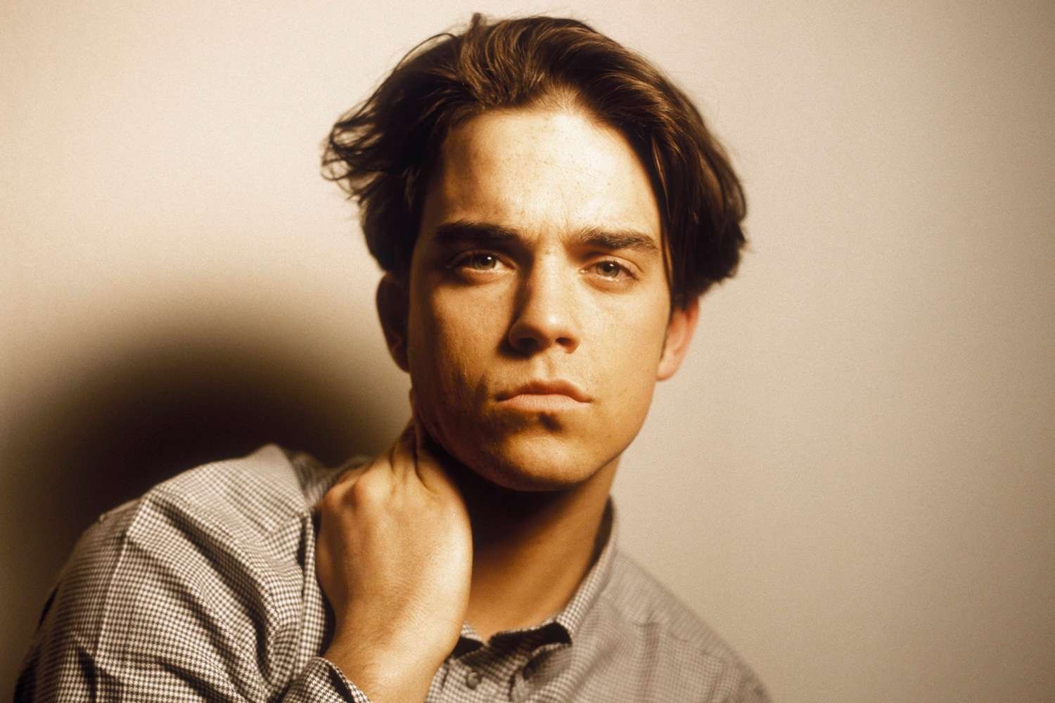 Robbie Williams Reflects on His Struggles with Depression During His Time with Take That