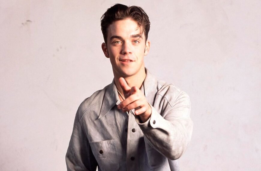 Robbie Williams Shares a Surprising Take on His Role as a Backing Dancer in Take That