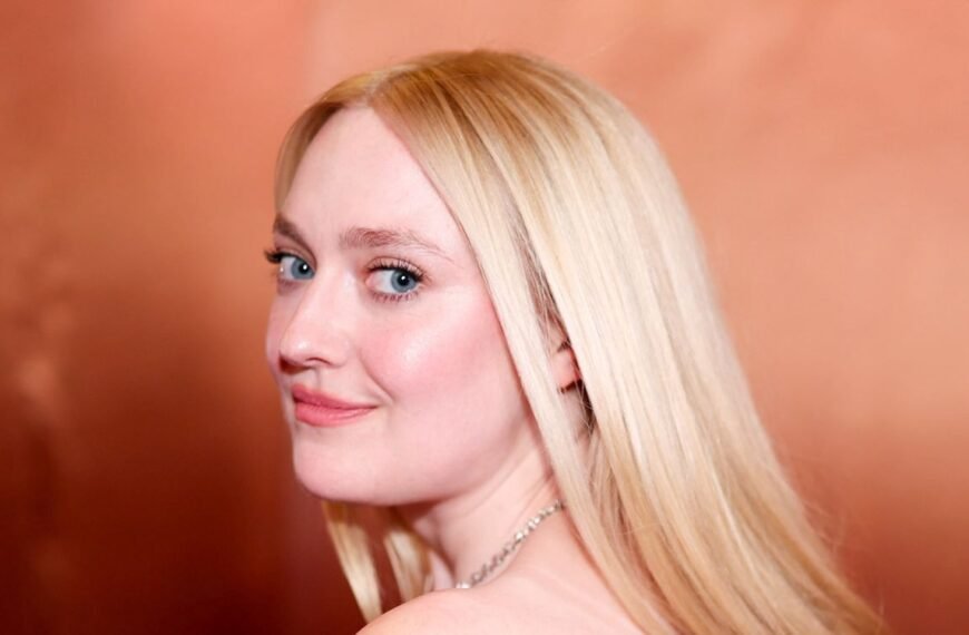 Dakota Fanning Styles a Sheer Blouse and Lace Shorts for Winter Fashion