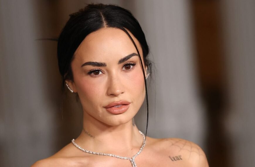 Demi Lovato Shows Off a Chic Look with a Black Bra and Diamonds Under a Cropped Satin Jacket