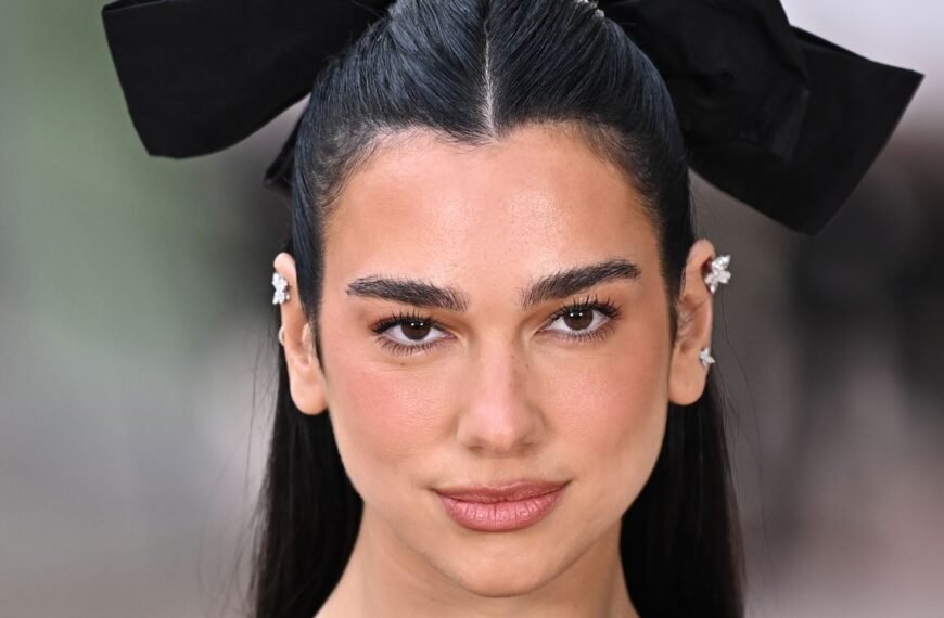 Dua Lipa’s $600 Sleeveless Little Black Dress Features Surprising Metallic Accents