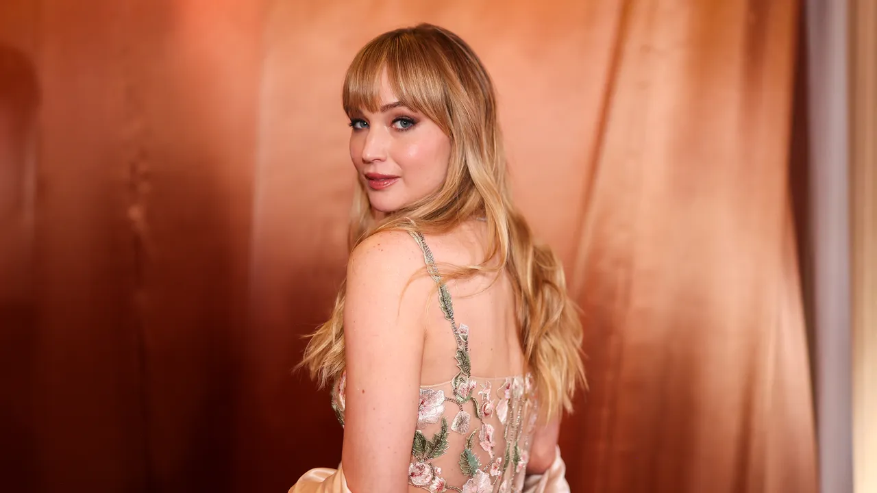 Jennifer Lawrence Dazzles in a Sheer Red Carpet Dress at the Golden Globes