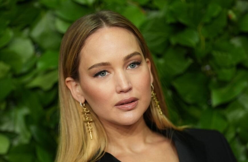 Jennifer Lawrence Shows Off a Fresh Look in a Soft Yellow Wrap Coat and a Unique Bag