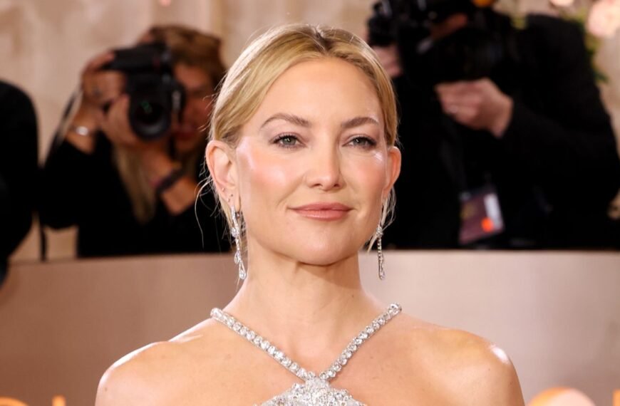 Kate Hudson Dazzles in a Bold Plunging Zip-Up Sequin Top at Paris Fashion Week