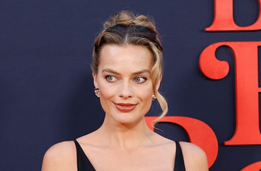 Margot Robbie Stuns in a Chic White Feather Minidress