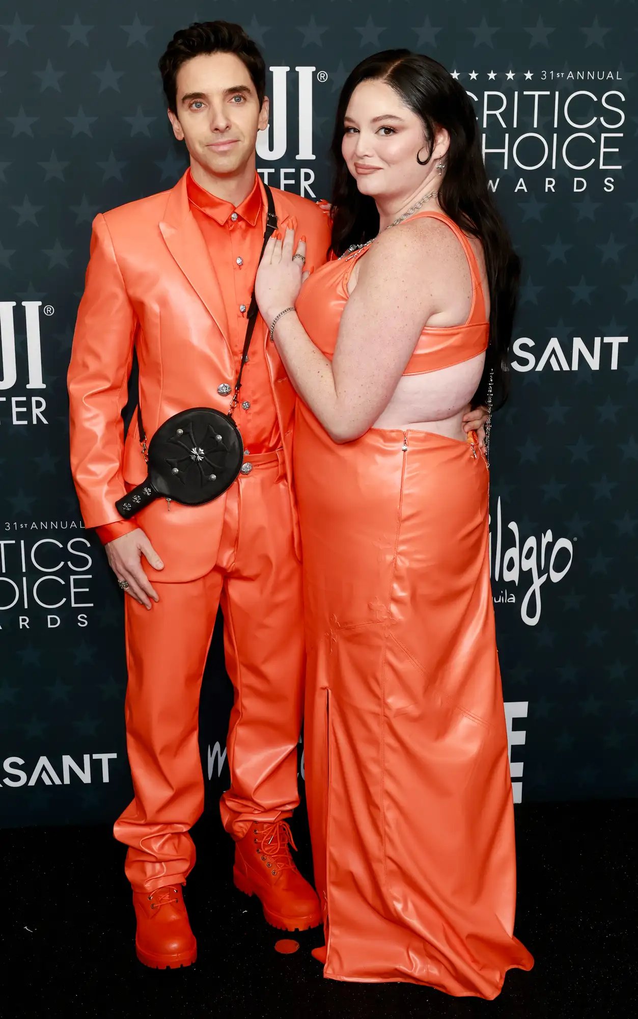 Paul W. Downs and Megan Stalter attend the 31st Annual Critics Choice Awards at Barker Hangar on January 04, 2026 in Santa Monica, California.