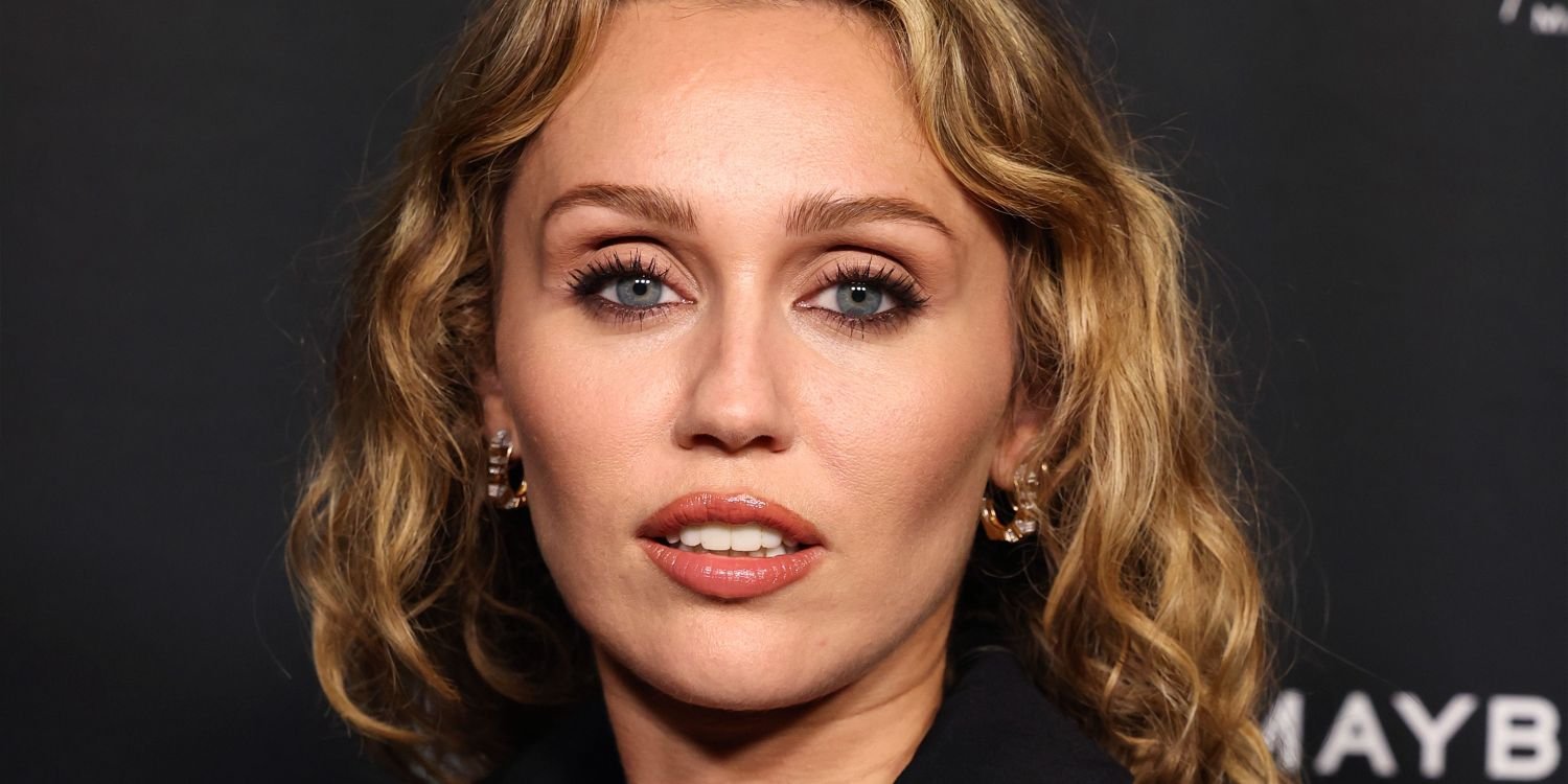 Miley Cyrus Wears a Bold Blouse with a Deep Cut and a Trendy Print