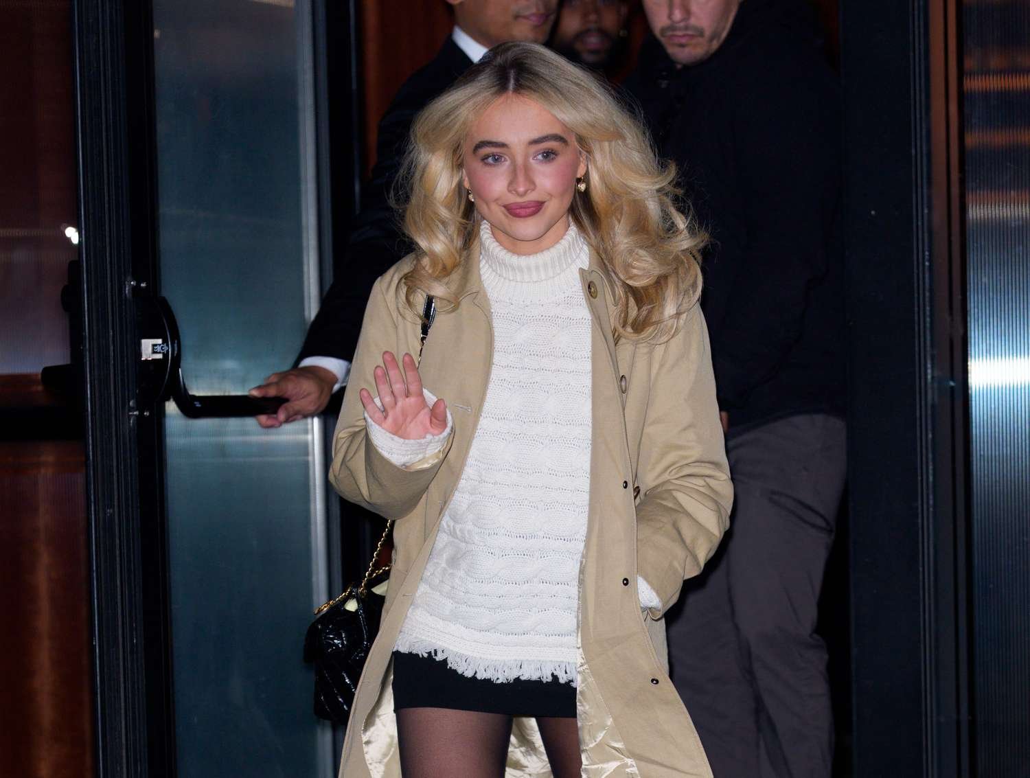 Sabrina Carpenter Dazzles in a Plunging Slip Dress with a Chic Touch of White Undergarment