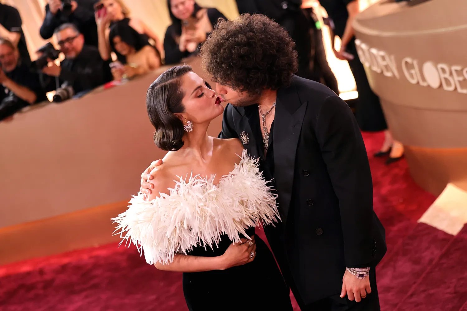 Selena Gomez kissing Benny Blanco on the red carpet at the Golden Globes