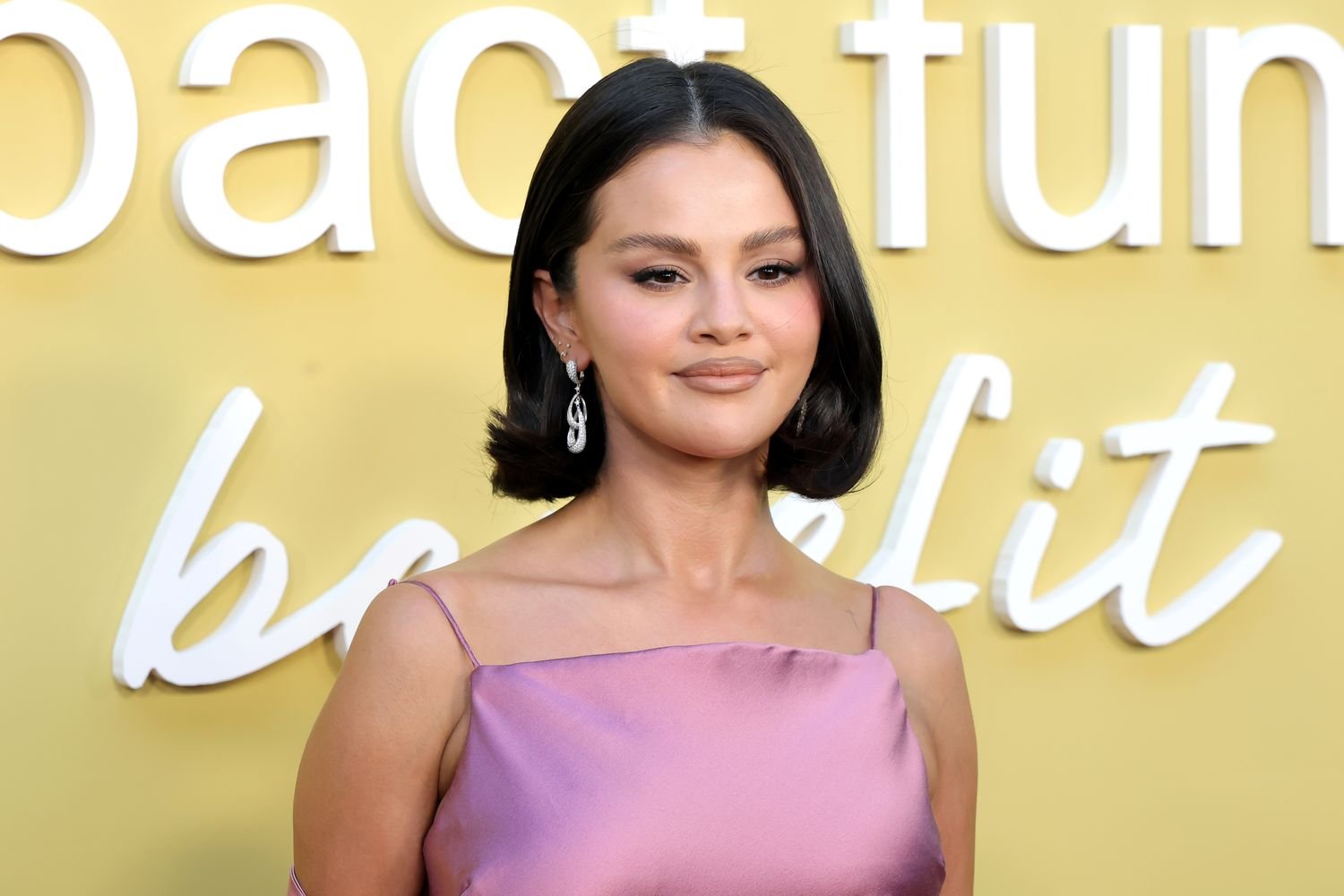 Selena Gomez Styles a Chic Low-Cut Dress with a Fresh Haircut and Side Part