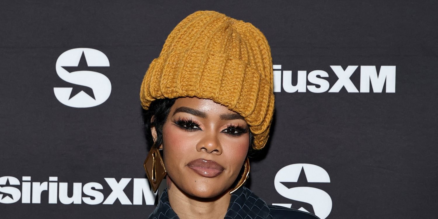 Teyana Taylor Styles a Sheer Lace Look with Chic Platform Heels and a Long Coat