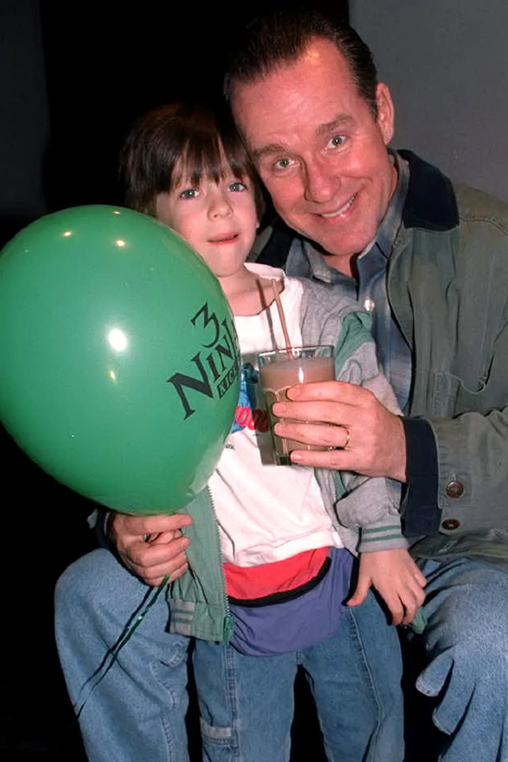 Phil Hartman with his son Sean at party following screening of "Three Ninjas Kick Back" at Planet Hollywood.