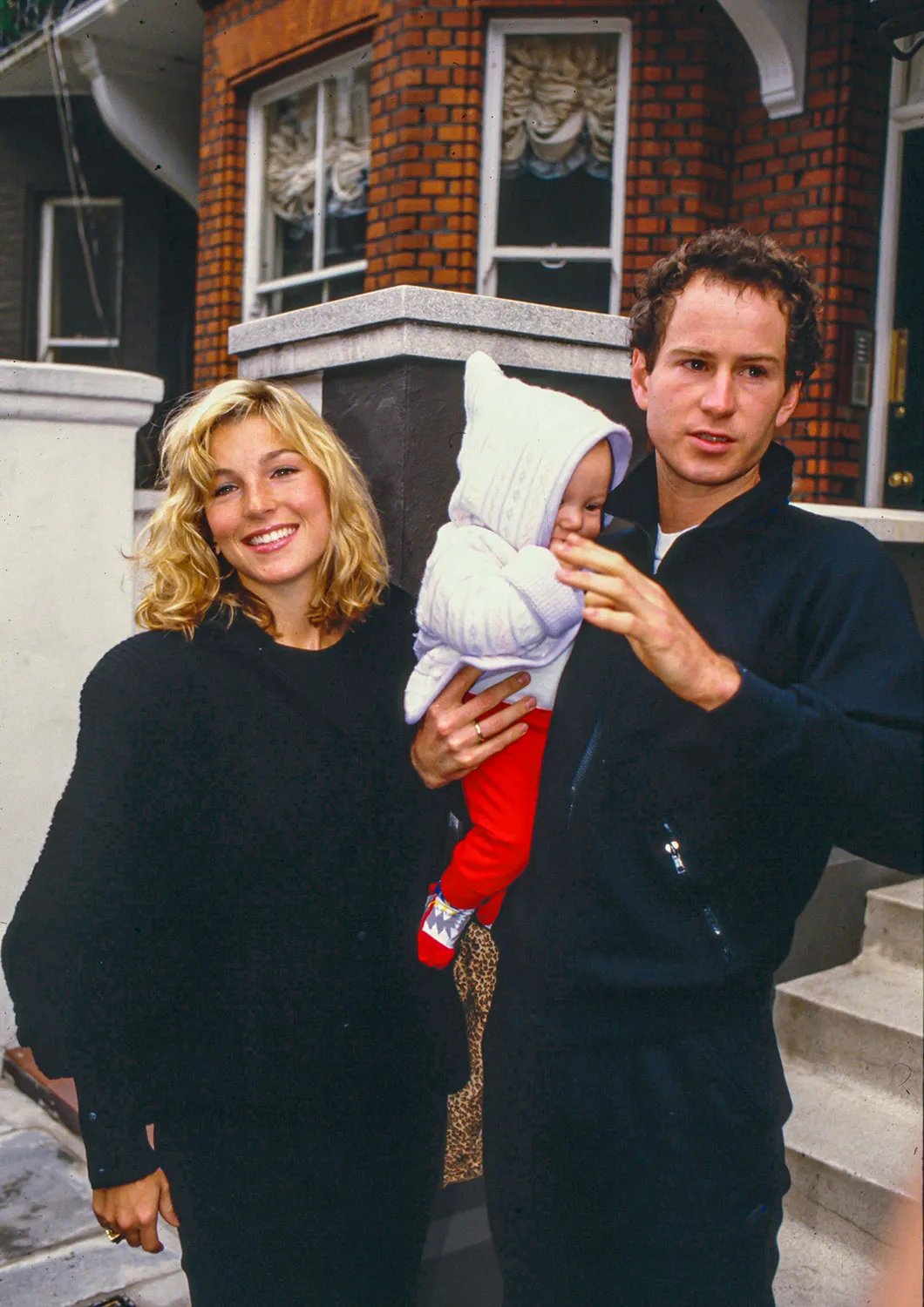 LONDON UNITED KINGDOM - NOVEMBER 11: John McEnroe, and wife Tatum O'Neal, with baby son Kevin in London, on November 11, 1986 in, London, United Kingdom.