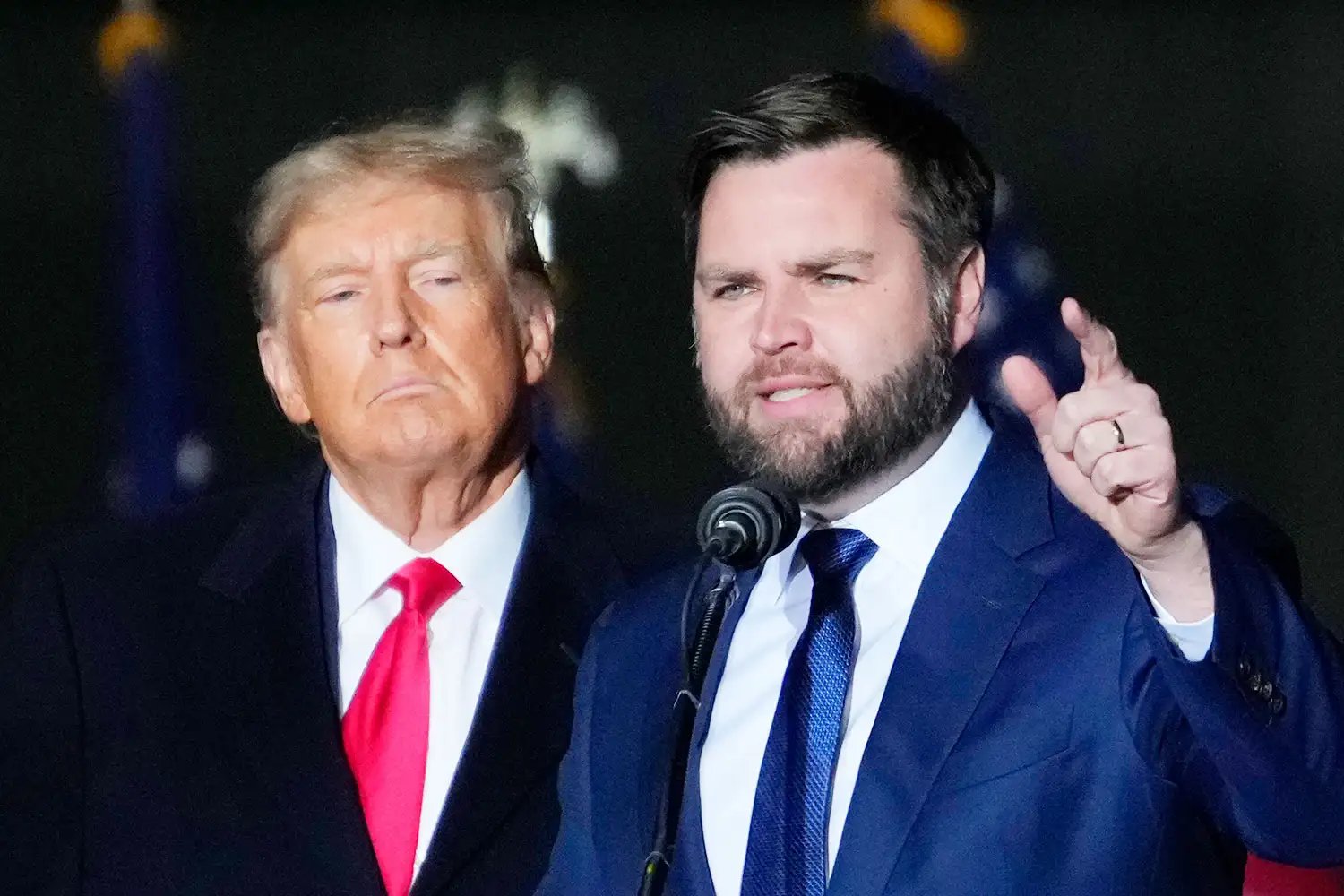 VANDALIA, OHIO - NOVEMBER 07: Former U.S. President Donald Trump and Republican candidate for U.S. Senate JD Vance greet supporters during the rally at the Dayton International Airport on November 7, 2022 in Vandalia, Ohio.