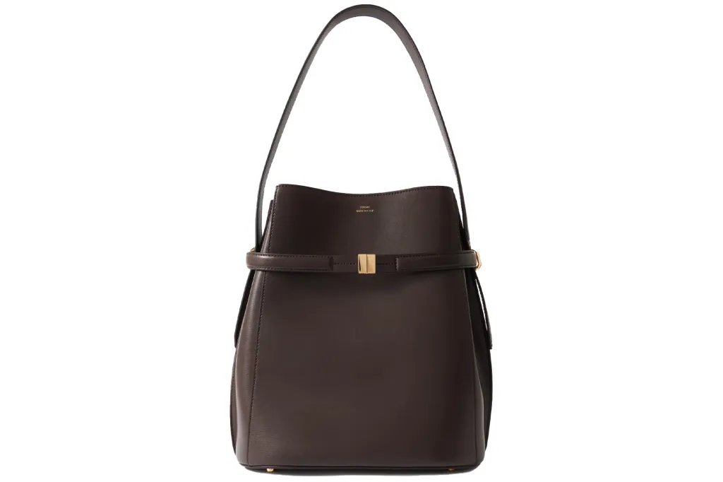 Totême dark brown leather bucket bag with top handle and gold-tone clasp.