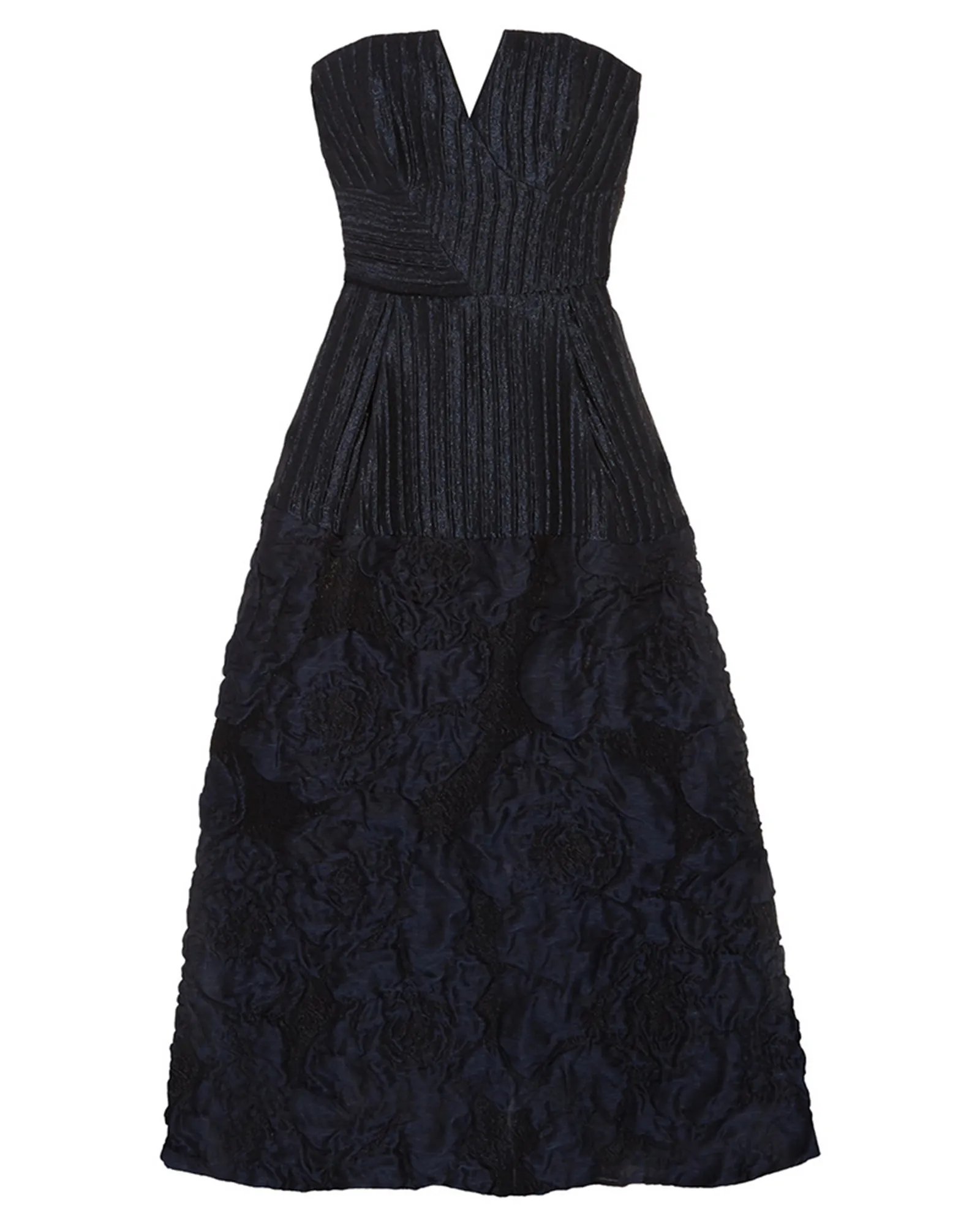 A long, dark blue strapless dress with a pleated bodice and a textured floral pattern on the skirt.