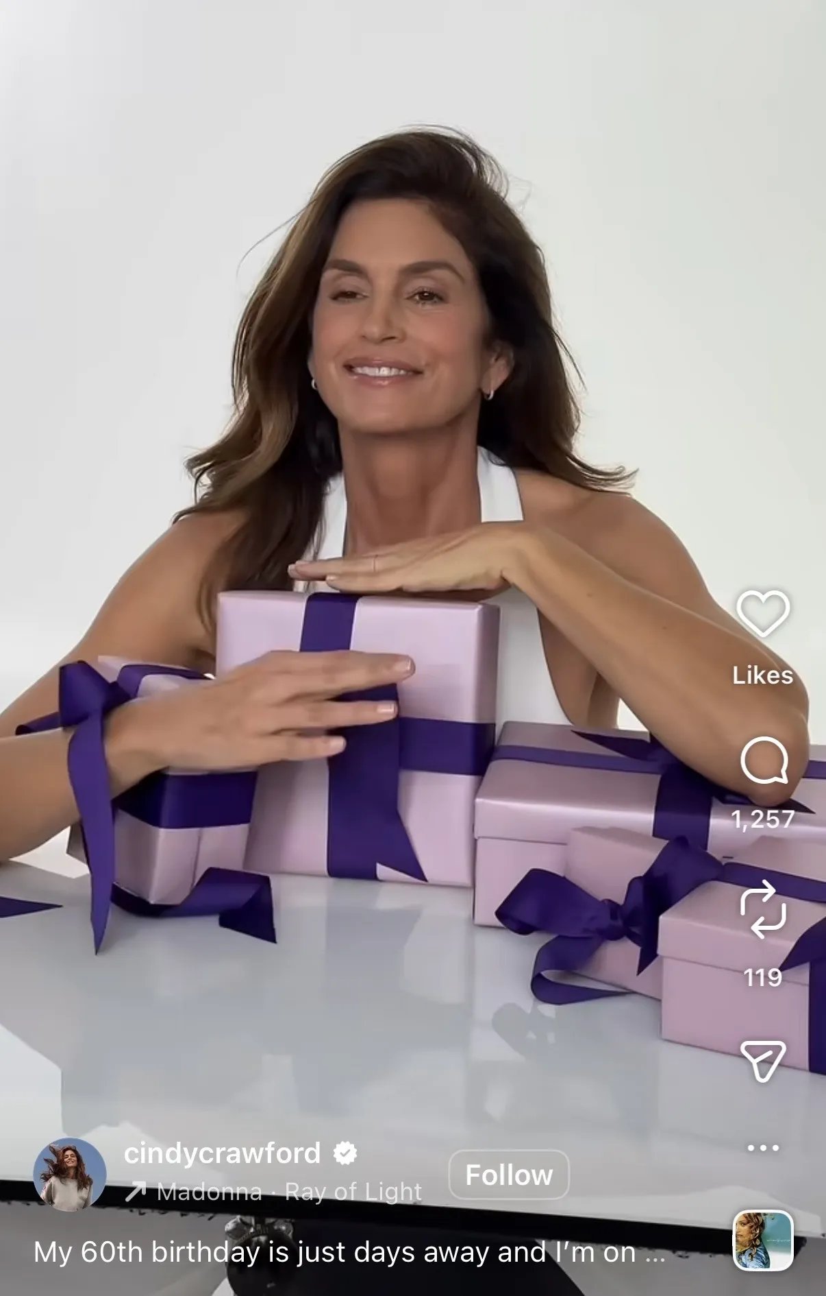 Cindy Crawford in a white tank top.