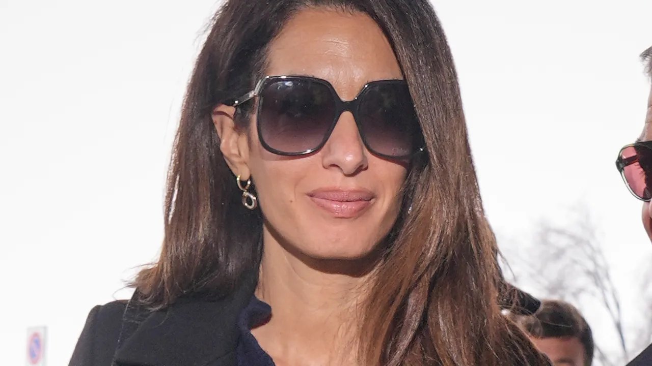 Amal Clooney's Stylish Spring Outfit: Bleached Bootcut Jeans and Square-Toe Boots