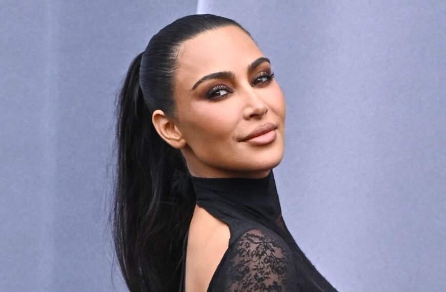 Kim Kardashian's Chic Monochromatic Mint Outfit with a Subtle Sheer Twist