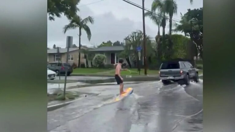 Long Beach Resident Catches Waves Amid Flooded Streets