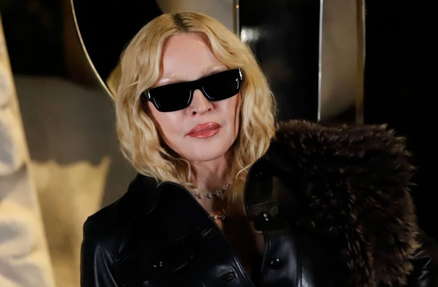 Madonna Stuns in a Black Lace Minidress with Gothic Details at Milan Fashion Week