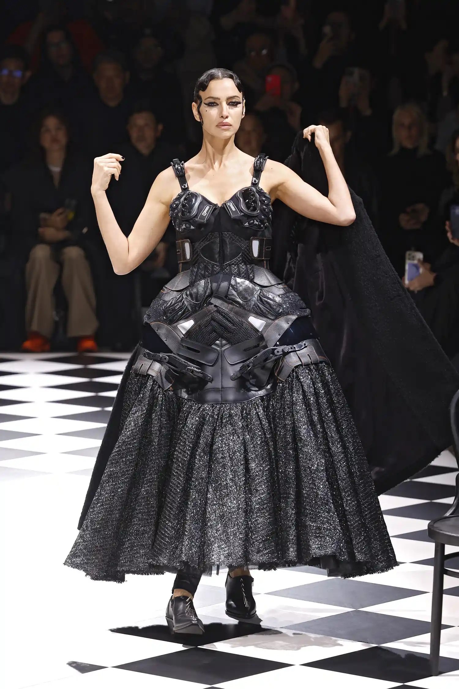 Irina Shayk in a black dress made of gloves