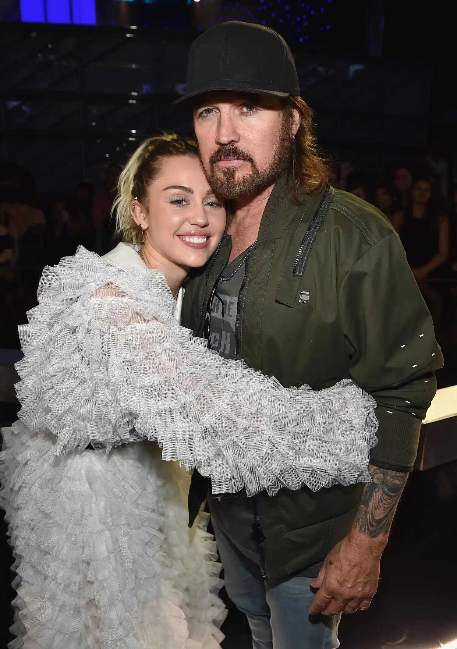 Miley Cyrus and Billy Ray Cyrus.