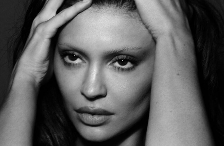 Kylie Jenner Shares Striking Topless Photoshoot in Bed with Stylish Stockings