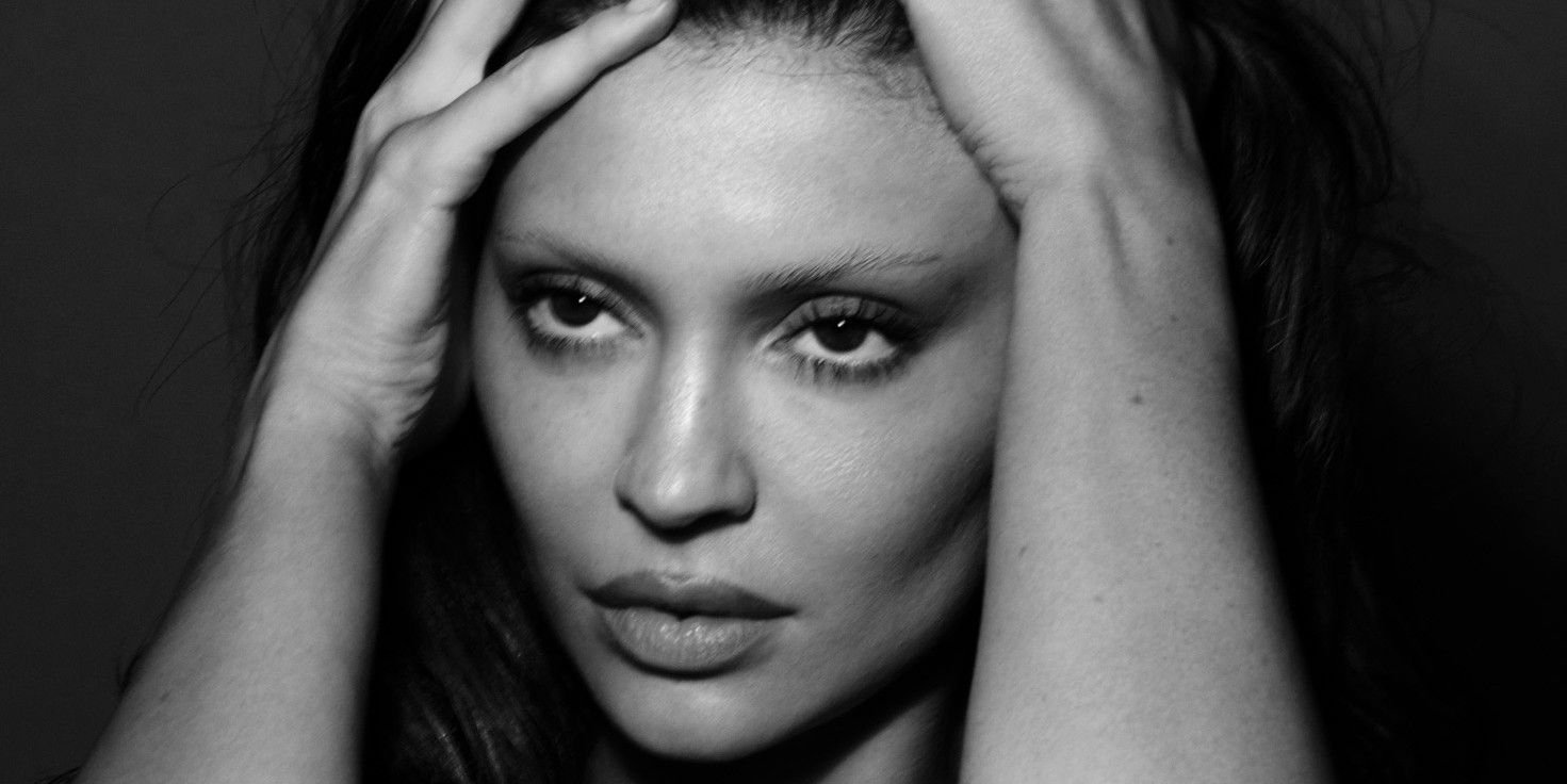 Kylie Jenner Shares Striking Topless Photoshoot in Bed with Stylish Stockings