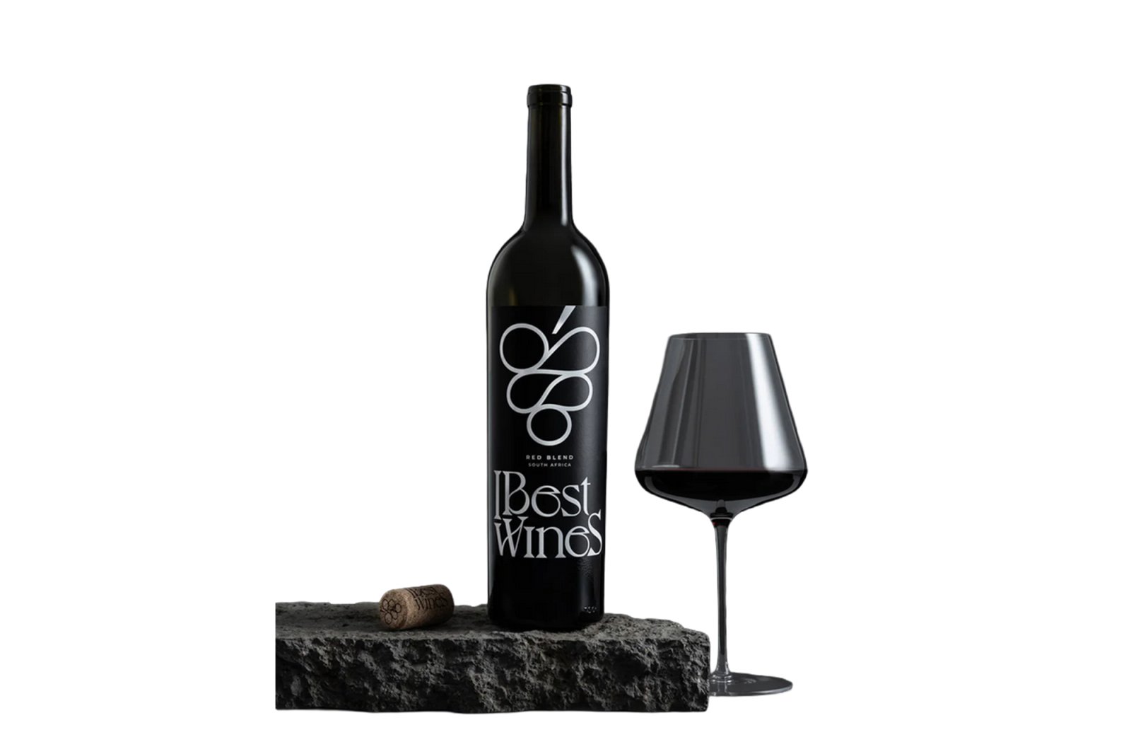 A bottle of "Best Wines Red Blend South Africa" and a glass of red wine on a dark stone.
