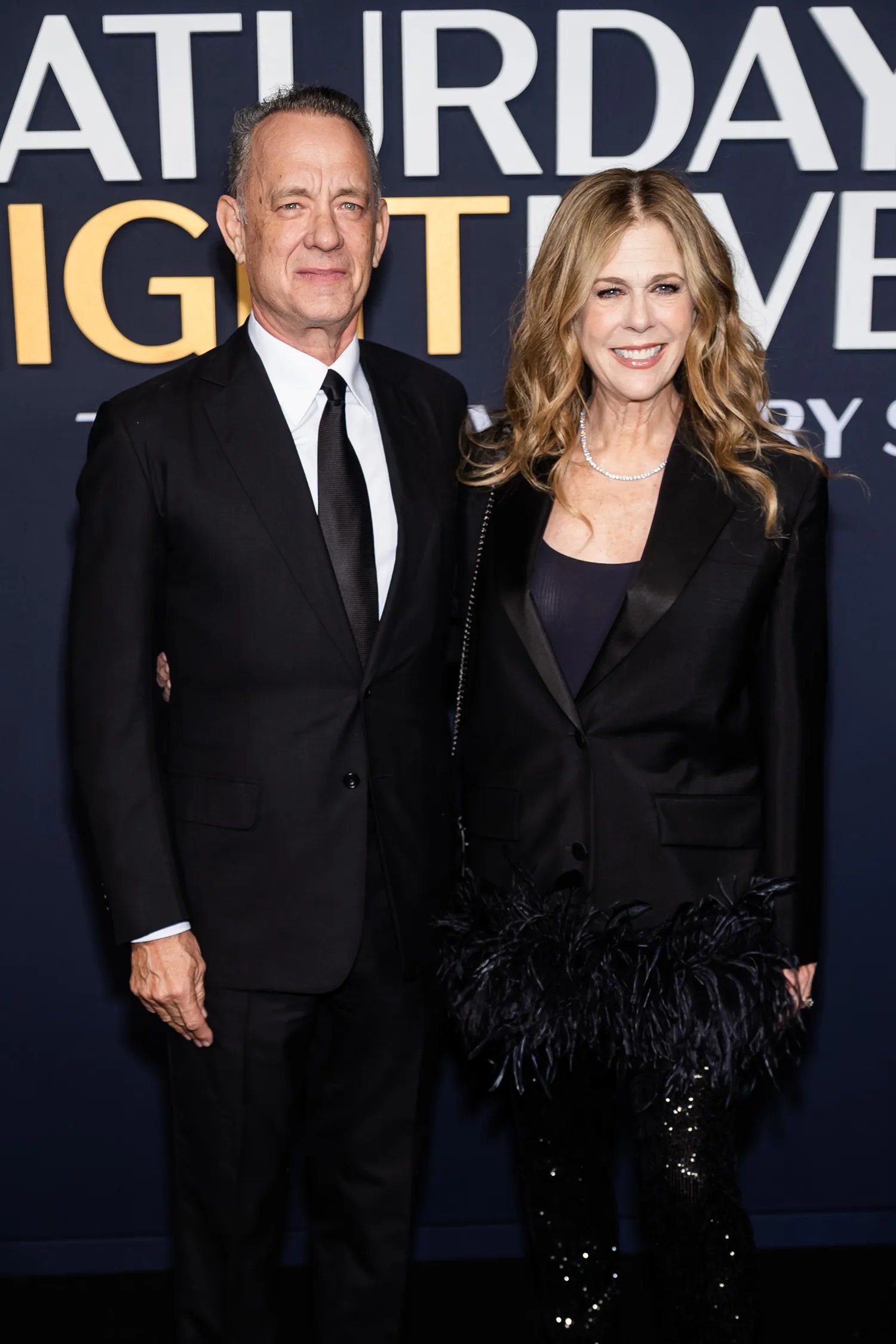 Tom Hanks and Rita Wilson posing together in formalwear