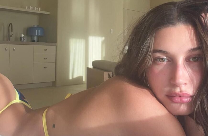 Hailey Bieber Enjoys a Relaxing Day by the Pool in Her Sunny Yellow Bikini