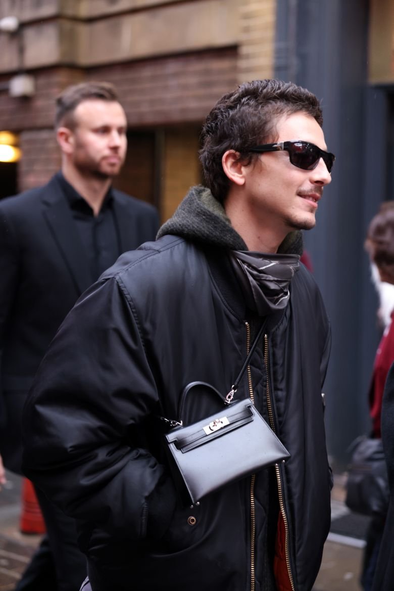 Timothée Chalamet wearing an Hermés mini Kelly to the 'Marty Supreme' Q&A in London last month.