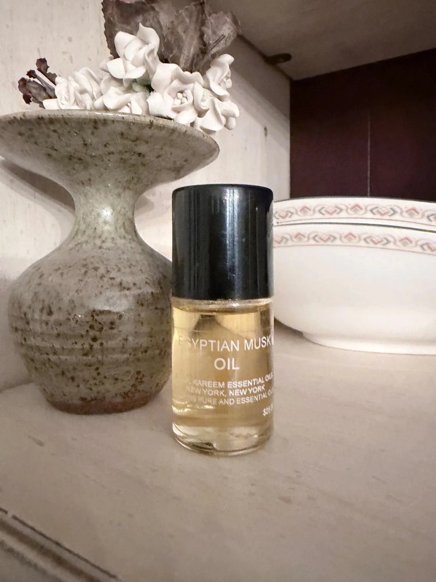 A small bottle of Egyptian Musk Oil by Kareem Essential Oils, New York.