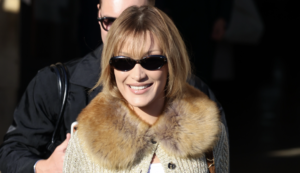 Bella Hadid Dazzles in a Chic Side-Baring Dress with a Unique Back Design