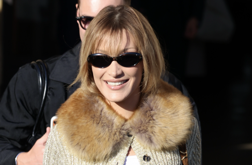 Bella Hadid Dazzles in a Chic Side-Baring Dress with a Unique Back Design