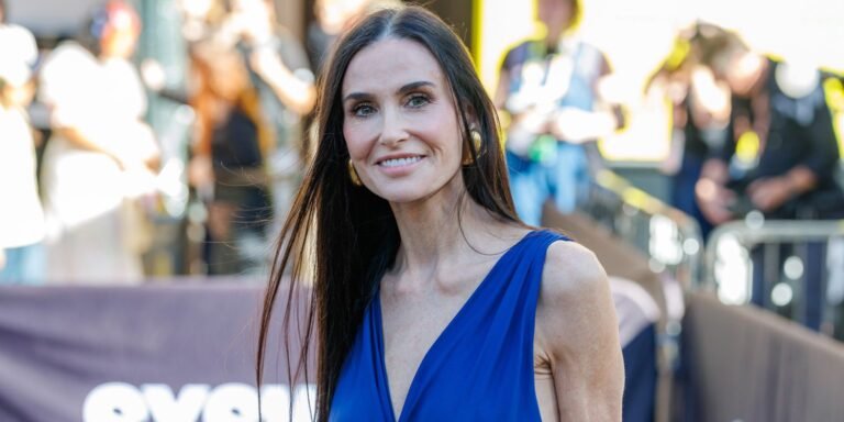 Demi Moore Wows in a High-Slit Wrap Dress Featuring a Unique Ribbon Detail