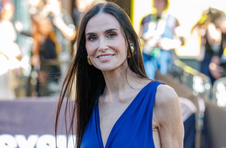 Demi Moore Wows in a High-Slit Wrap Dress Featuring a Unique Ribbon Detail
