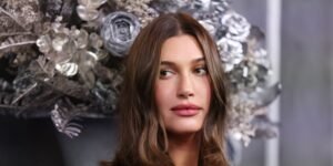 Hailey Bieber Combines a Leather Midiskirt with Cozy Knitwear for a Stylish Rocker Vibe