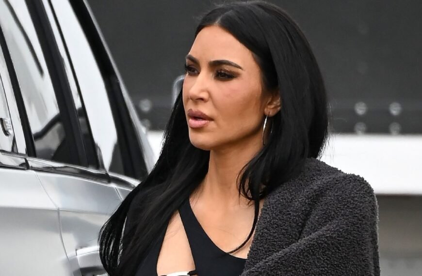 Kim Kardashian Stuns in a Sparkling Corset Bodysuit and Feathered Headdress
