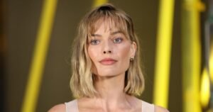 Margot Robbie's Stylish Wine-Red Tote: Your Ideal Travel Companion