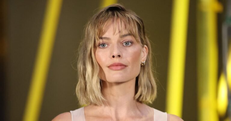 Margot Robbie's Stylish Wine-Red Tote: Your Ideal Travel Companion