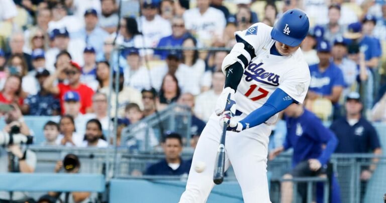 Plaschke: Dodgers Celebrate Titles on a Bright Opening Day