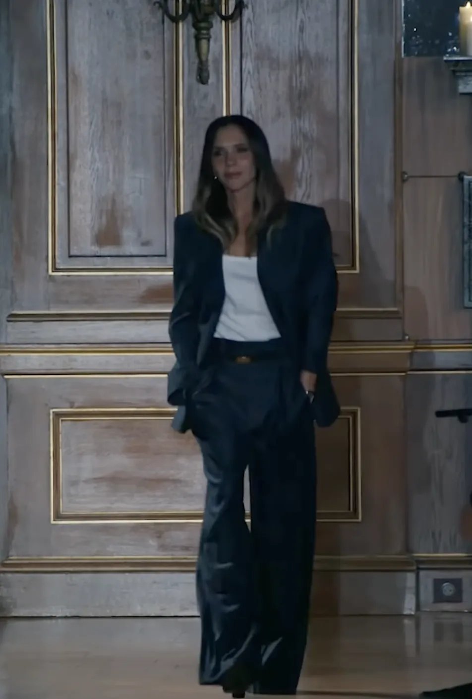 Victoria Beckham in a gray suit