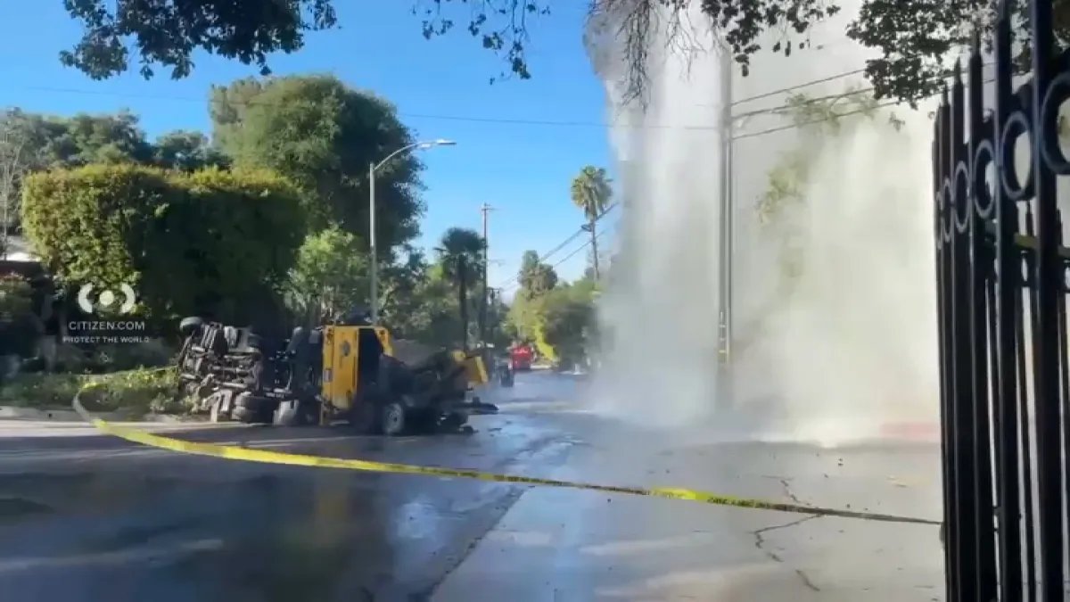 Water Spews from Broken Hydrant Following Crash in Encino