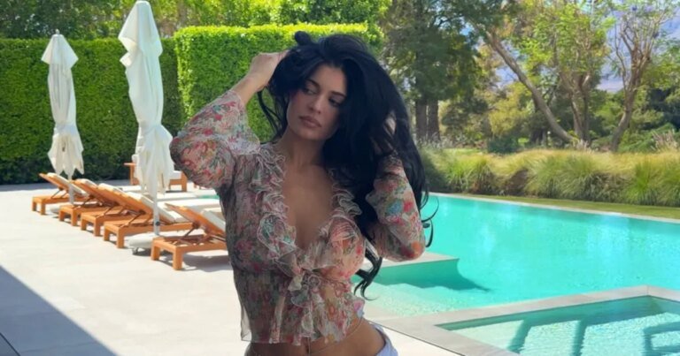 Kylie Jenner Styles a Belly Chain with Unbuttoned Jeans and a Bold Top for Easter Celebrations