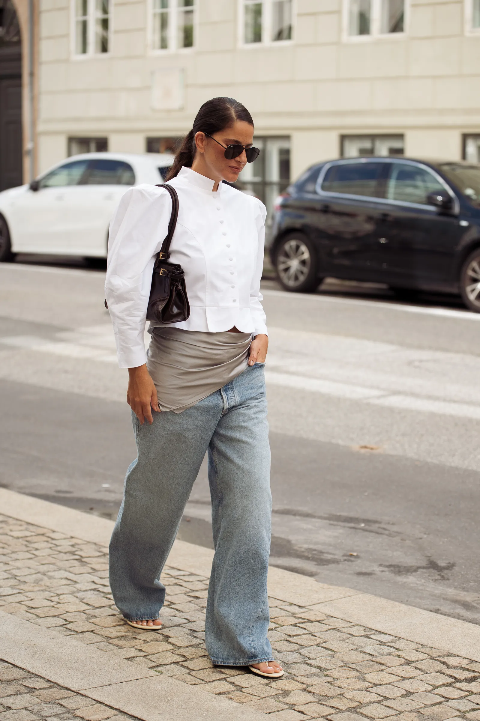 Copenhagen Fashion Week attendee wearing a silk scarf around her hips