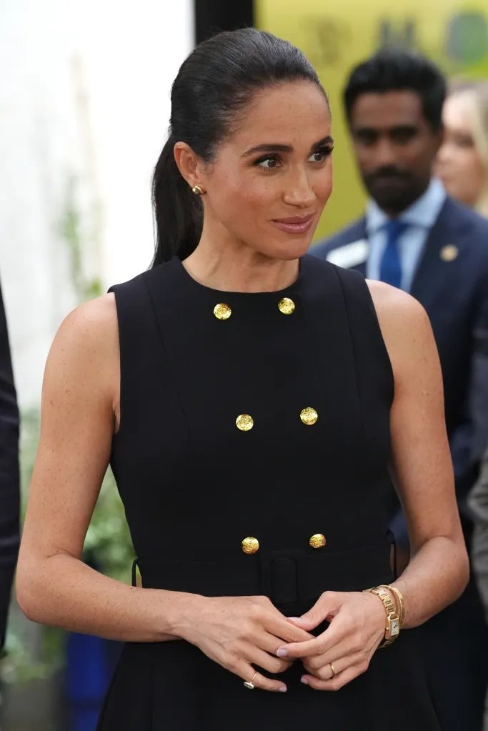 Meghan, Duchess of Sussex, in a black sleeveless dress with gold buttons, at the Royal Children's Hospital in Melbourne, Australia.